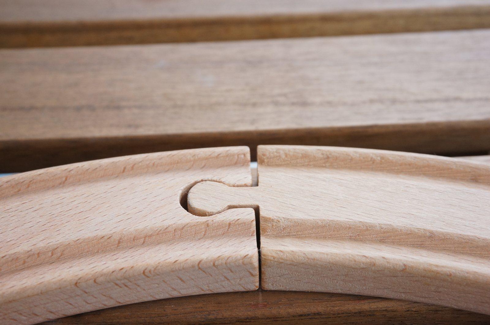 Close-up of a curved wooden joint between two interlocking pieces