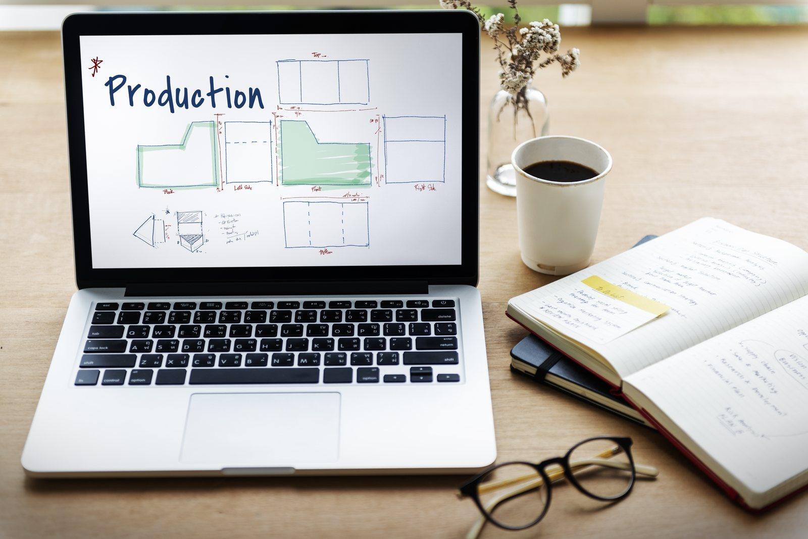 Laptop screen showing a hand-sketched orthographic production drawing with front, back, side and bottom views