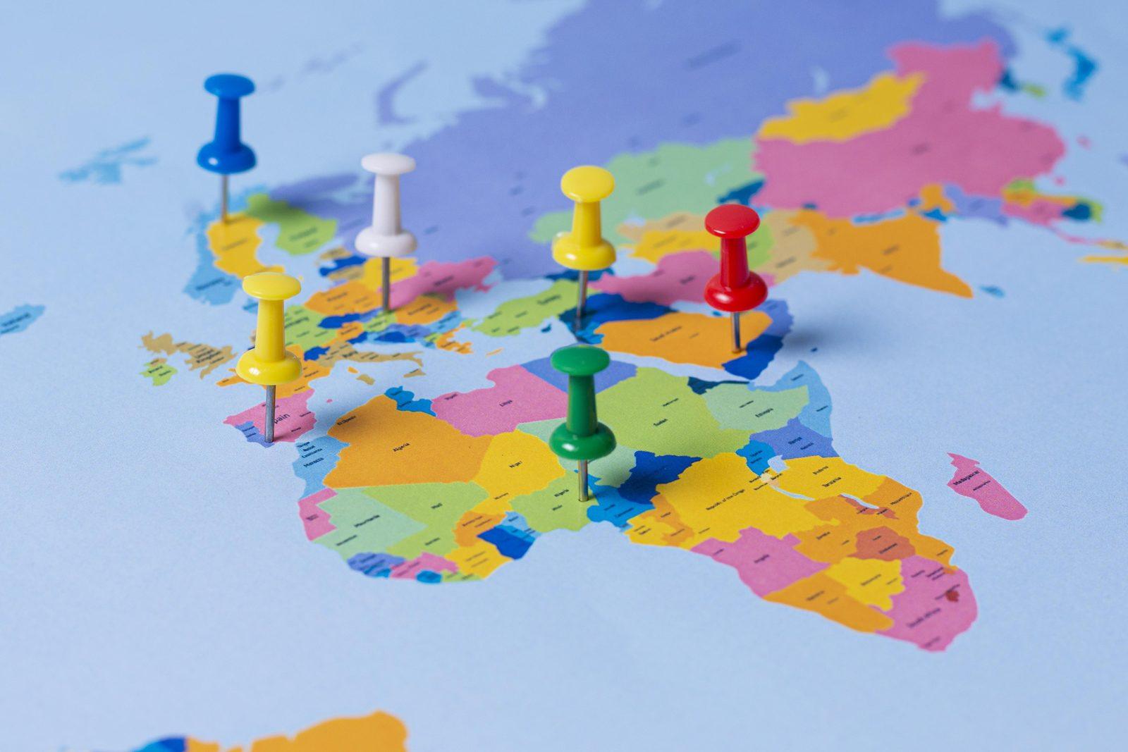 World map with coloured pins marking several locations